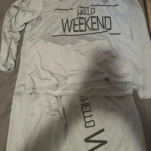 Two sets of pajamas one has kittens on it and the other says hello weekend